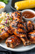 © A2Z AI  - Plate of Grilled Chicken Drumsticks: Deliciously Cooked, Perfect for Summer BBQs and Family Dinners.