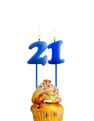 Candle in shape of the number 21 - Blue birthday on a white background.