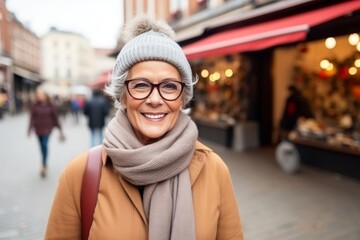 Sticker - Portrait of a happy senior woman with eyeglasses on a shopping street