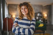 © Miljan Živković - Portrait of adult caucasian woman with curly hair at home happy smile