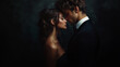 © Madlen Gray - An intimate kiss between a couple in formal attire, captured in dramatic lighting against a dark background