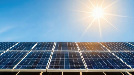 Solar panels installed on a rooftop under bright sunlight with clear blue sky.