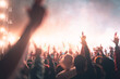 © Take Production - nightclub, nightlife, stage, dance, music, entertainment, musician, night, party, festival. A crowd of people are at a concert, with many of them holding up their hands in the air.