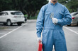 © sorapop - Close up of professional mechanic Hands of car mechanic with wrench. Midsection of a car mechanic in workwear holding large wrench in auto repair on the road. Car mechanic proudly posing.