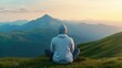 © Intelligent Horizons - A person sitting in a meditative pose gazing out at a breathtaking mountain landscape during a stunning sunrise or sunset  The scene evokes a deep sense of tranquility serenity