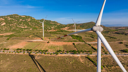 Landscape with Turbine Green Energy Electricity, Windmill for electric power production, Wind turbines generating electricity on field at Phan Rang, Ninh Thuan, Vietnam. Clean energy concept.