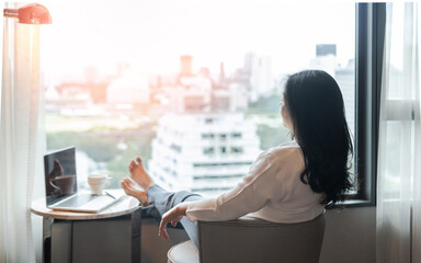 Wall Mural - Simple life style relaxation with Asian working business woman healthy lifestyle take it easy resting in comfort hotel or home living room having free time with peace of mind and self health balance