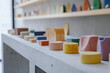 © Nelly - Minimalistic display of colorful foam clay blocks.