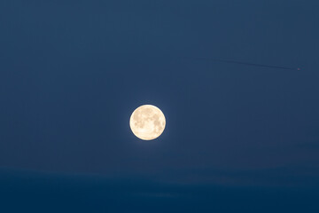 full moon over blue sky