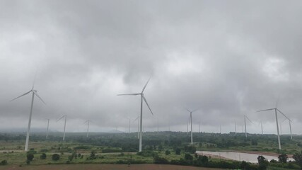 Wall Mural - large field with many wind turbines in the background