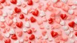 © maikuto - A scattered arrangement of red, pink, and white heart-shaped candies on a soft pink background, evoking a sweet and romantic feel..
