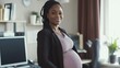 © RaptorWoman - Confident pregnant woman in an office environment, embodying professional success and maternity. Ideal for themes of work-life balance.