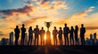 © SerPhoto - A group of business people standing around the gold trophy, concept success and victory, leadership.