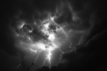 A dramatic dark sky is filled with vibrant lightning strikes highlighting the intensity and power of the storm, evoking awe and fear of nature's might and beauty.