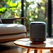 © NUTTAWAT - A modern speaker placed on a wooden table, blending seamlessly with a cozy interior, surrounded by green plants and soft lighting.