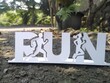 © paul - a papercut craft of two runner illustration with the word run on asphalt with road background