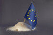 © Лозовая Людмила - A mountain of granulated sugar and the flag of the European Union in close-up on a light background. Europe is one of the main sugar producers in the world.