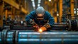 © Diegeme - Welder Working on Steel Pipes in Industrial Factory