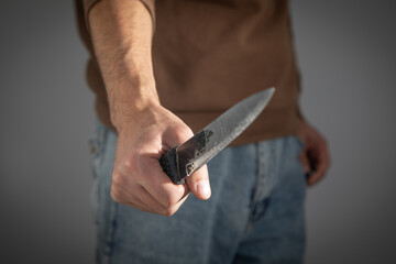 Caucasian man holding knife. Concept of crime