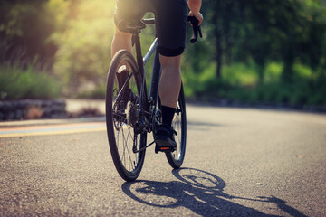 Wall Mural - Cyclist riding bike at summer park