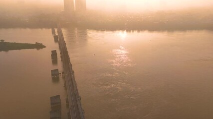 Wall Mural - Aerial view of Long Bien bridge over Hong river (or Red river) that connects two districts, Hoan Kiem and Long Bien in Hanoi city, Vietnam.