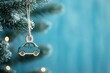© Anastasiia S - Wooden toy blue car ornament on Christmas tree, blur blue background, Copy space. Concept: New Year, Christmas decorations, holiday celebrations, for car service