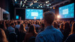 © Daniel - A rear view of the audience attentively listening to a speaker on stage at a business conference, forum, seminar
