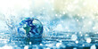© CreativeStudio - A blue planet is surrounded by water and is being splashed by water