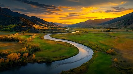 Leinwandbilder - Glowing mesh streams gracefully meandering through a serene and picturesque valley surrounded by the majestic snow capped peaks of a mountain range