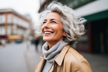 Sticker - Portrait of happy senior woman walking in the city, looking at camera