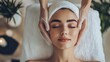 © muft - A woman receiving a facial treatment in a serene spa setting.