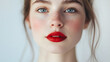 © Екатерина Чумаченко - Portrait of a woman with bold red lipstick, isolated on a white background
