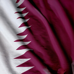 State of Qatar flag waving in the wind. Soft and smooth silk. Cloth fabric texture ensign background. Use it for national day and country occasions concept