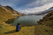 © Noppasinw - Grindelwald First Switzerland nature landscape at Bachalpsee Lake (Bachsee) with woman tourist