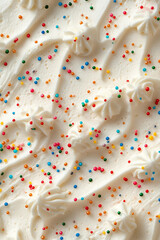 white frosting, colorful rainbow sprinkles texture,  flat lay photography, macro shot