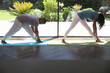 © Caia Image - Woman and man with Down syndrome practice yoga