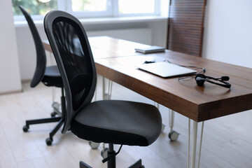 Poster - Black chairs, laptop and desk in office