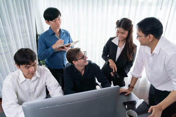 Group of diverse office worker employee working together on strategic business marketing planning in corporate office room. Positive teamwork in business workplace concept. Prudent