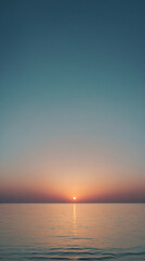 Wall Mural - Vibrant sunset over a calm ocean reflecting soft gradient hues on a clear evening