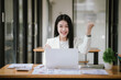 © Witoon - Happy Asian Women's Business Women work at the desk using laptops and calculators to analyze financial data. About the growth of financial and accounting organizations