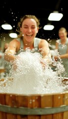 A joyful participant splashes water during a lively group activity in a bustling indoor space