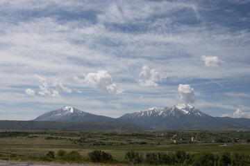 Landscape view of Colorado’s freestanding, snow-covered Spanish Peaks in May