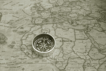 Wall Mural - classic round compass on background of old vintage map of world