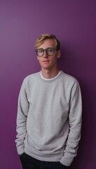 Confident Young Man with Glasses Posing Casually Against a Purple Background for Modern Portrait Design