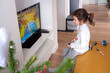 © Road Red Runner - A 5-year-old girl plays a video game console at home.