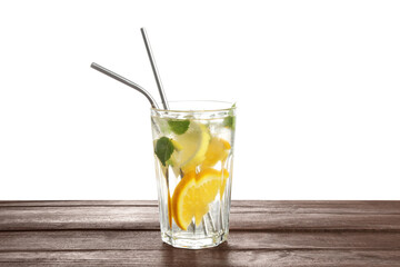 Poster - Glass of tasty refreshing drink and straws on wooden table against white background