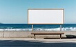 © Mavita - A blank billboard near a beach, with gentle waves and a clear sky, sits above a wooden bench, inviting creativity and contemplation by the water.