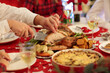 © famveldman - Family with kids having Christmas dinner at tree