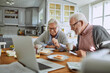 © Marko Geber - Happy senior couple eating breakfast together at kitchen table