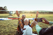 © Marko Geber - Senior woman celebrating after tandem skydiving with instructor